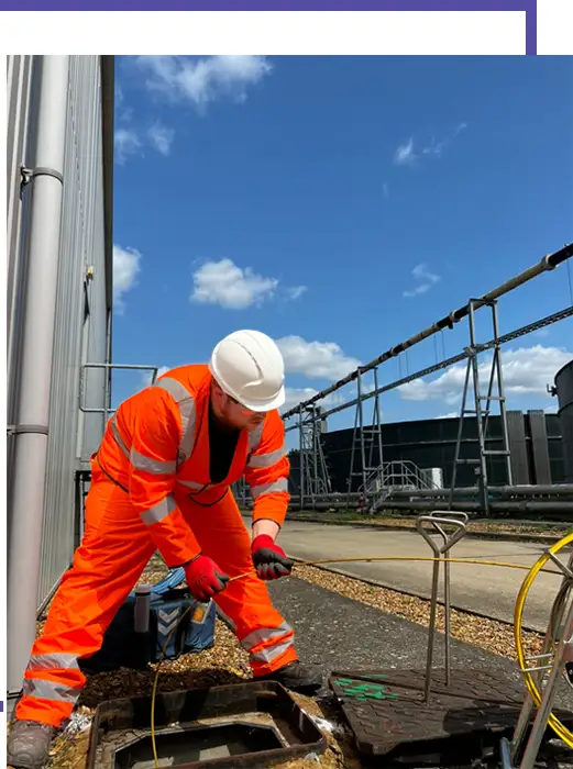 Ambler Group surveyor working at an inspection chamber